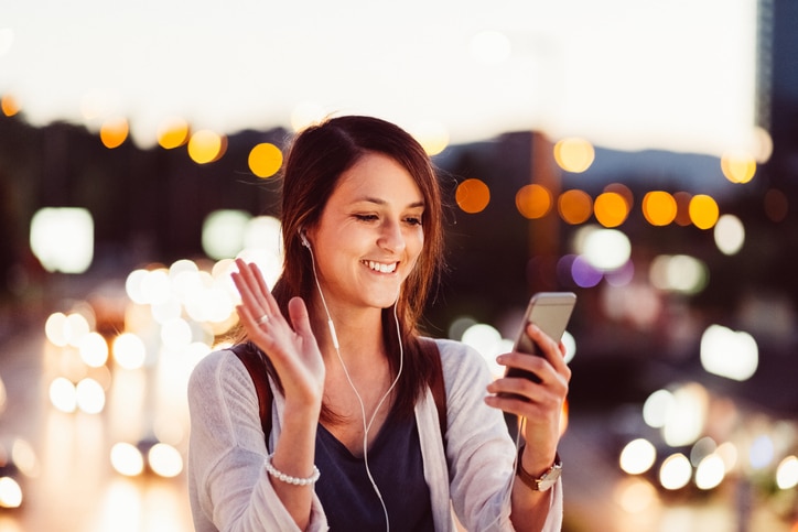 Smiling woman saying hello on a video call